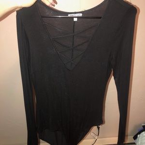long sleeve body suit, low neck with criss cross